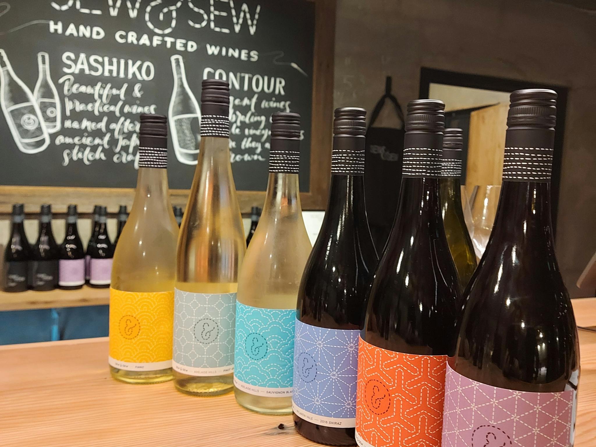 Wine bottles lined up on bar