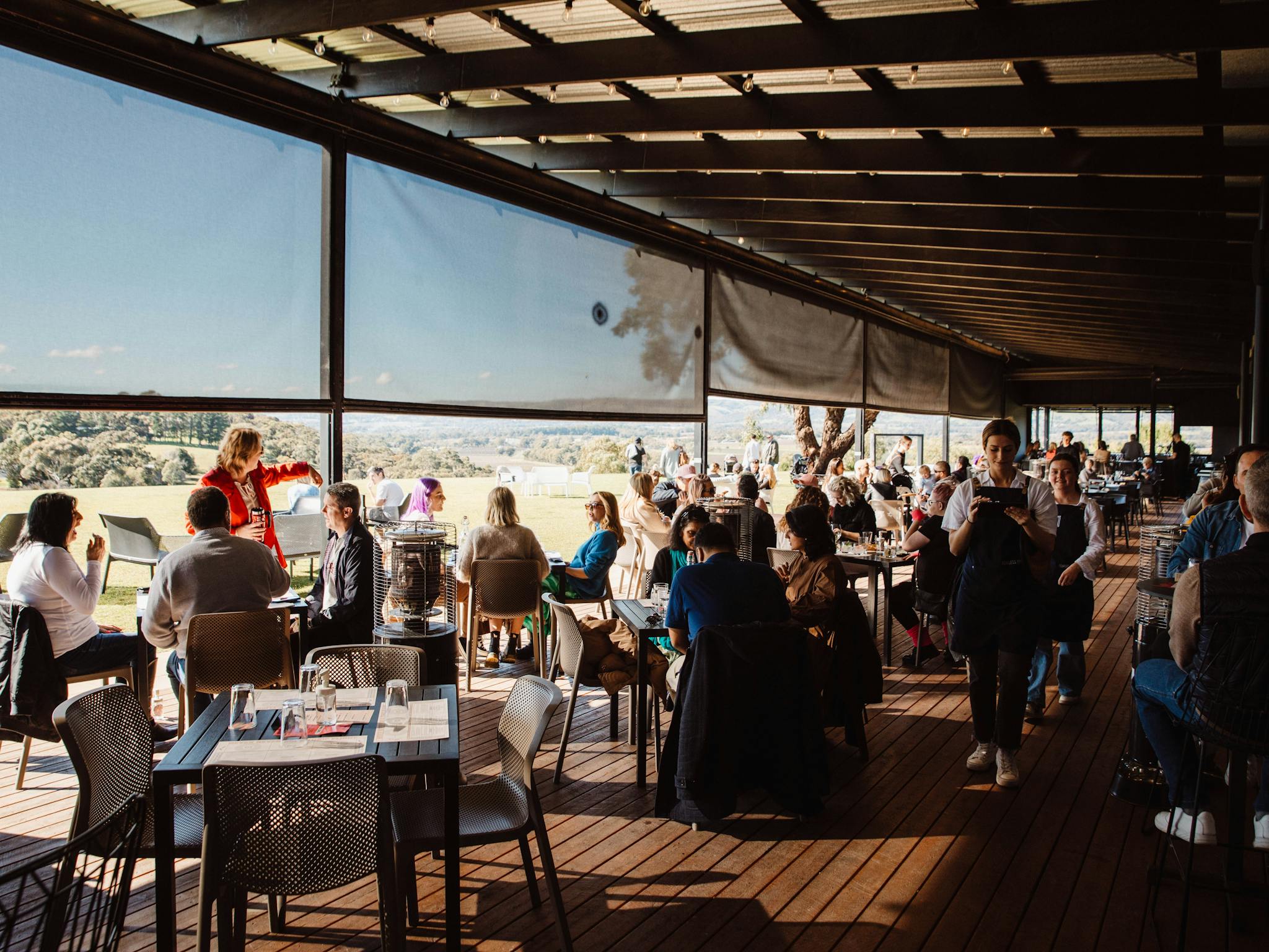 a busy sunday session with tables full of guests enjoying live music and delicious award winning gin