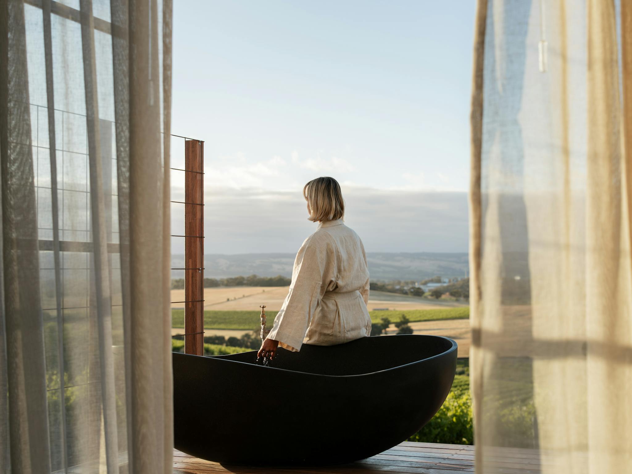 A large stone bath on the deck invites you to watch the world go by.