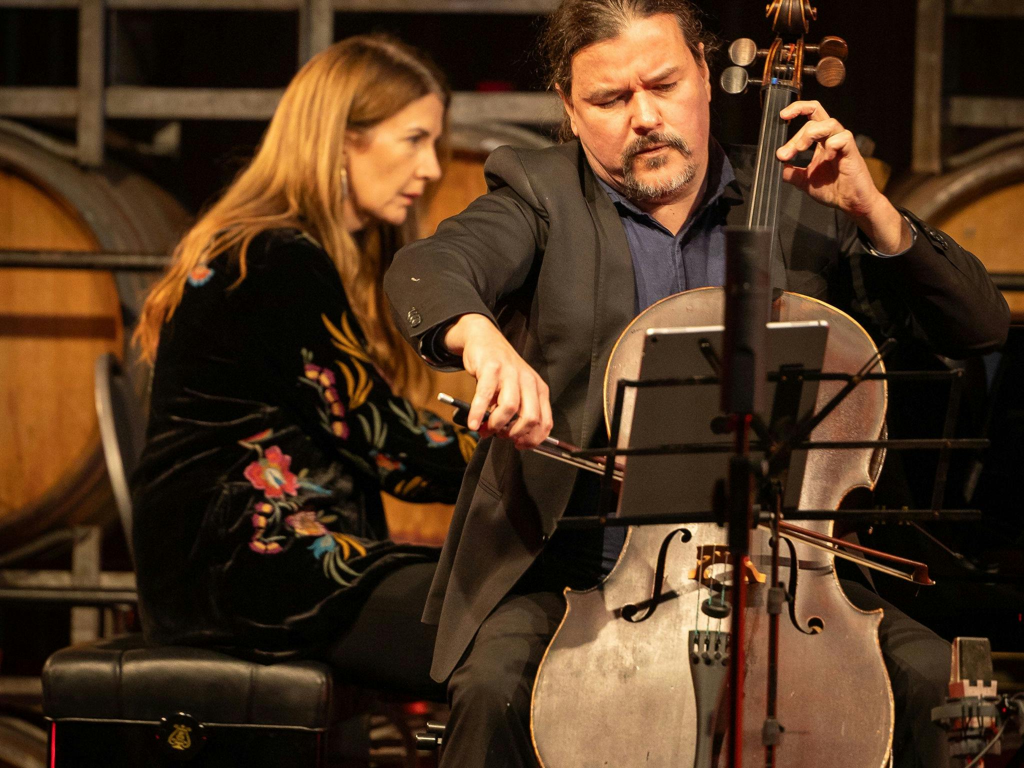 A cello performer and a piano performers on stage at the Coriole Music Festival