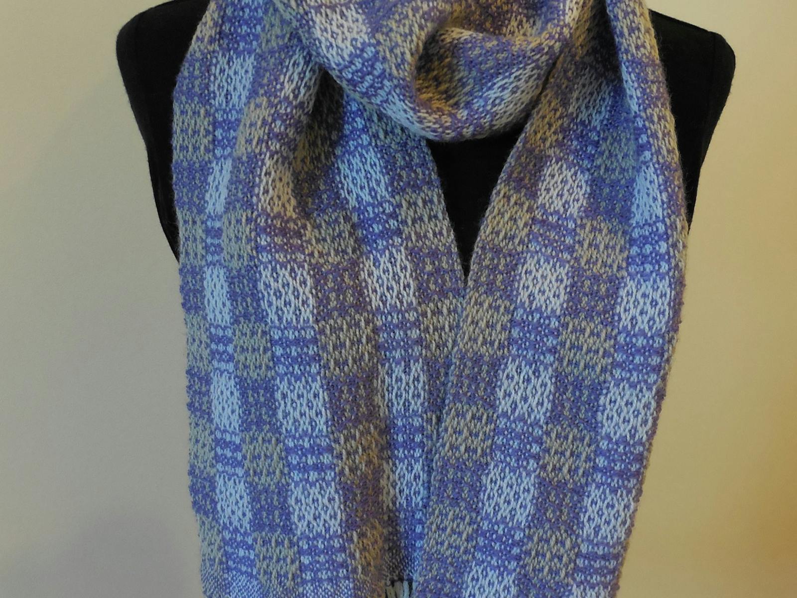 a blue scarf woven with a square pattern