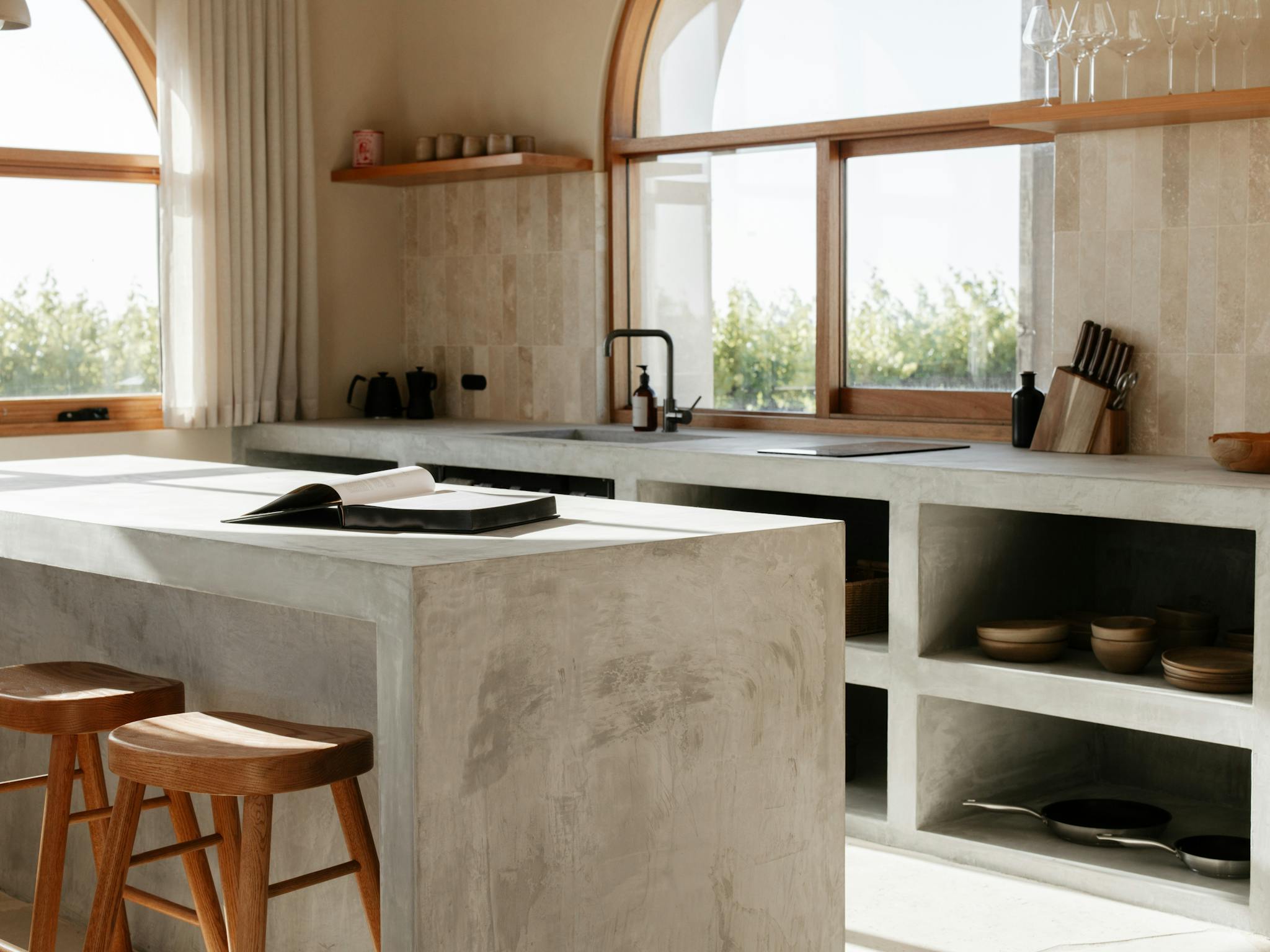 Stone ~ open plan kitchen with JamFactory ceramic tableware and custom stools.