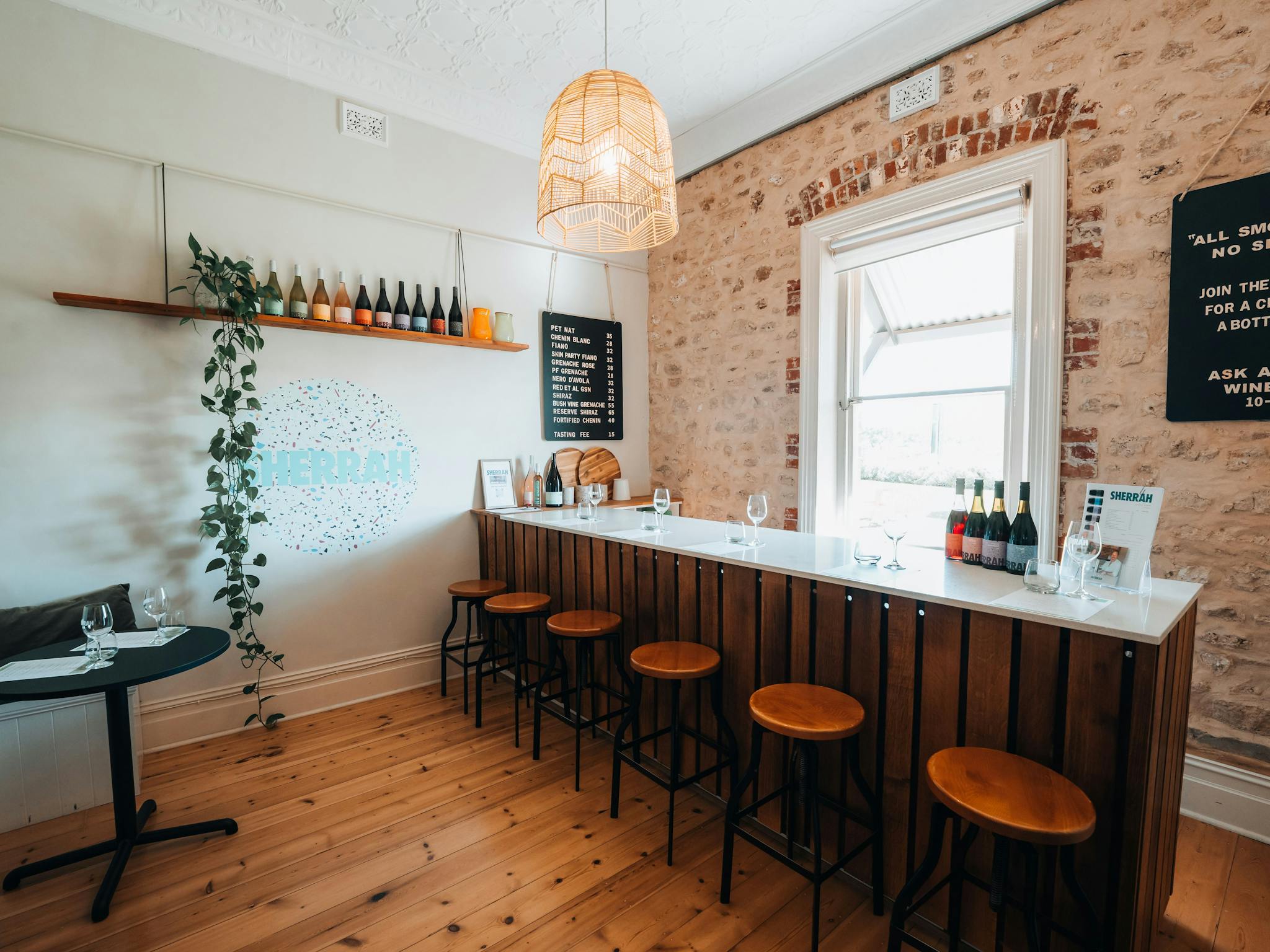 Cellar door room with a window and a bar.