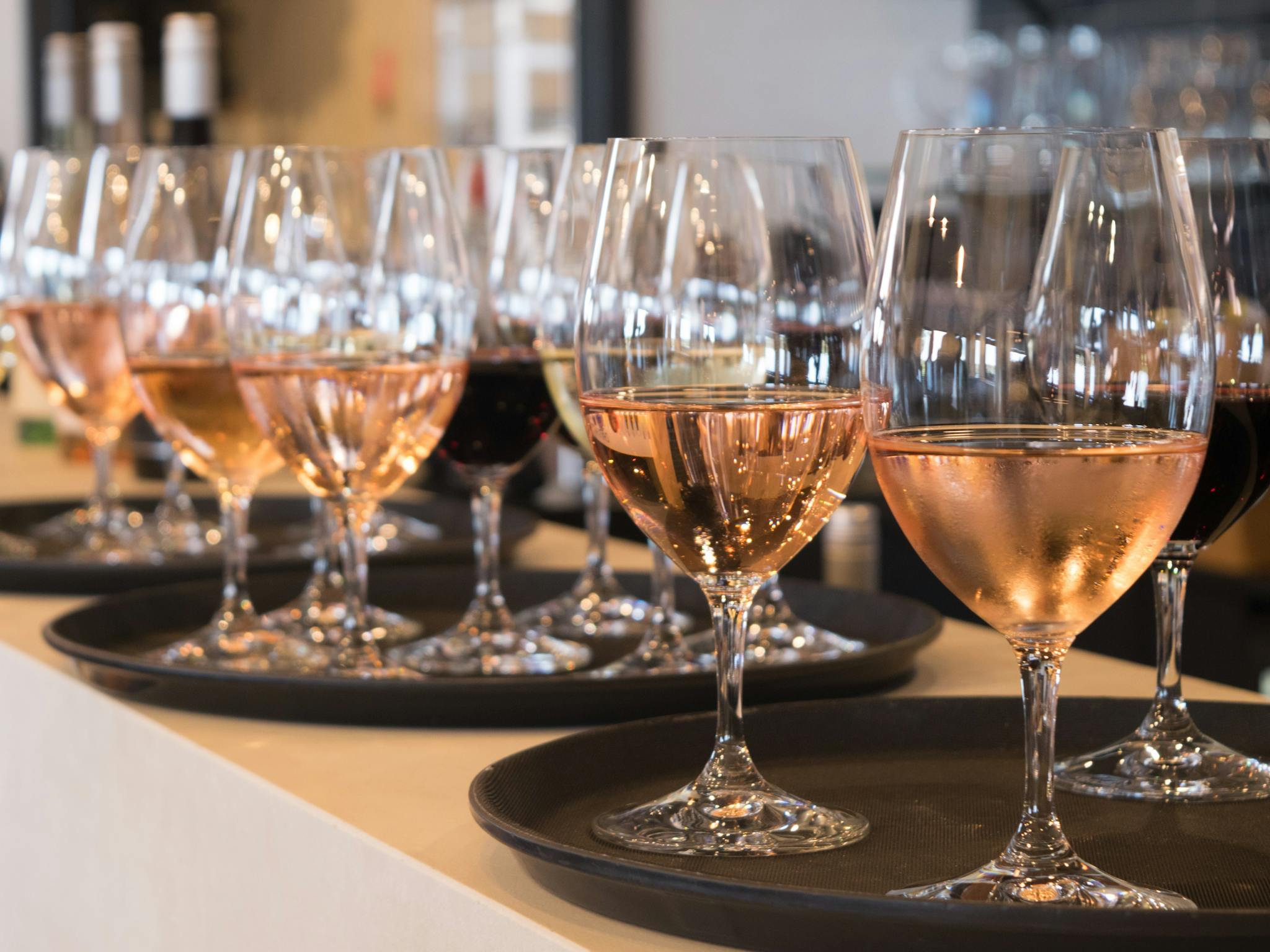 glasses of wine on trays ready to be served