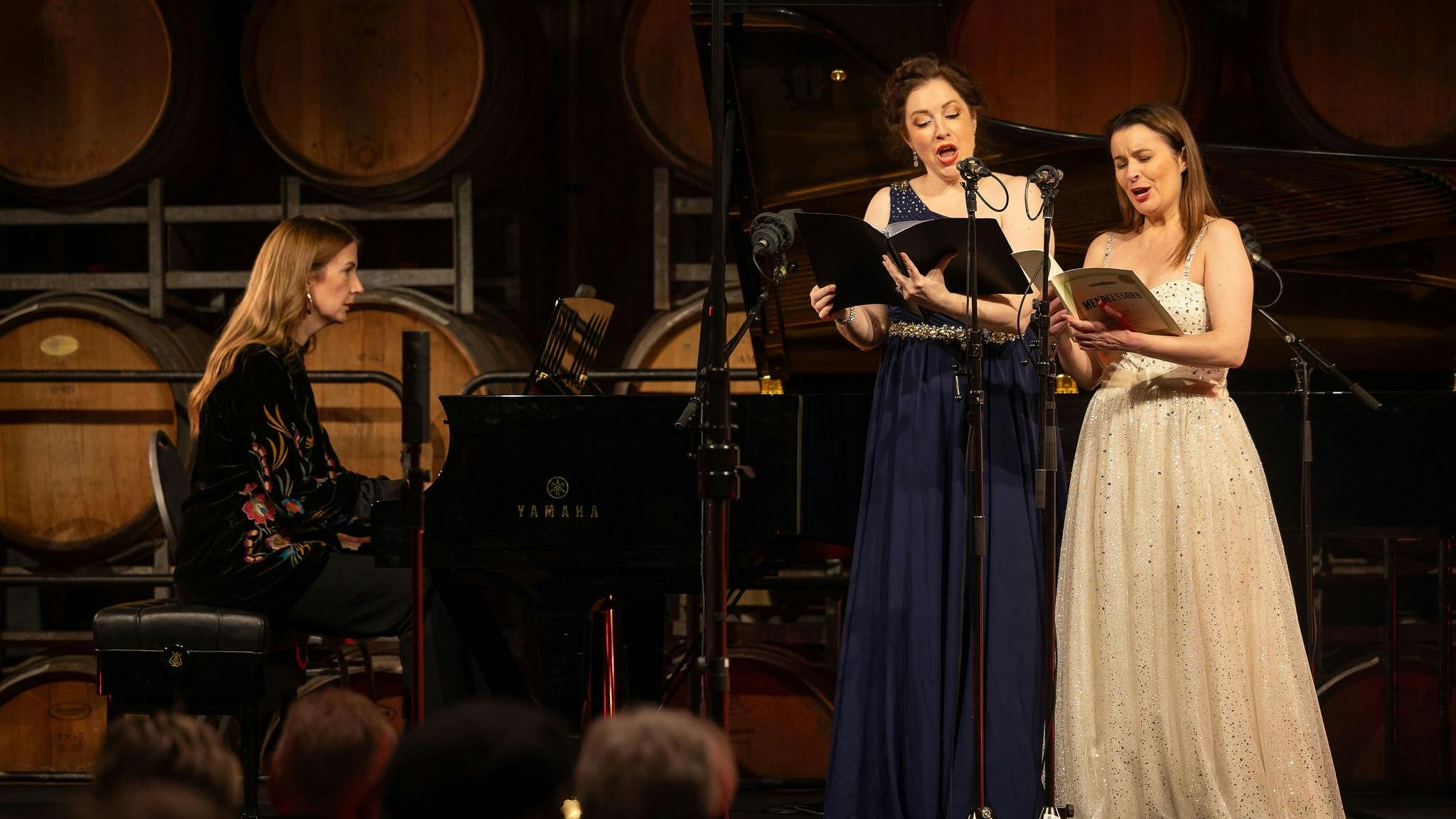 two singers and a pianist on stage, performing a duet at the Coriole Music Festival