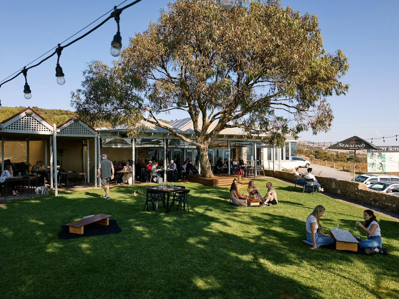 Grassed outdoor area with pub in background