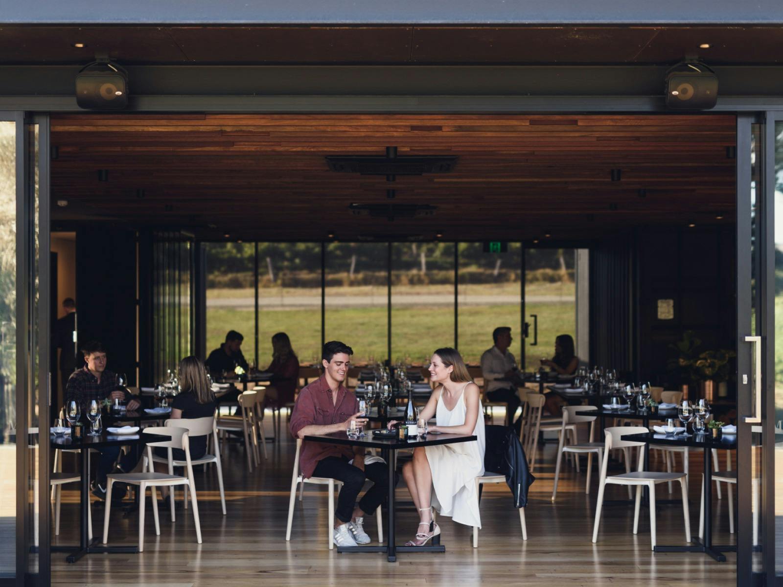 Two people eating at Little Wolf Restaurant at Mitolo Wines