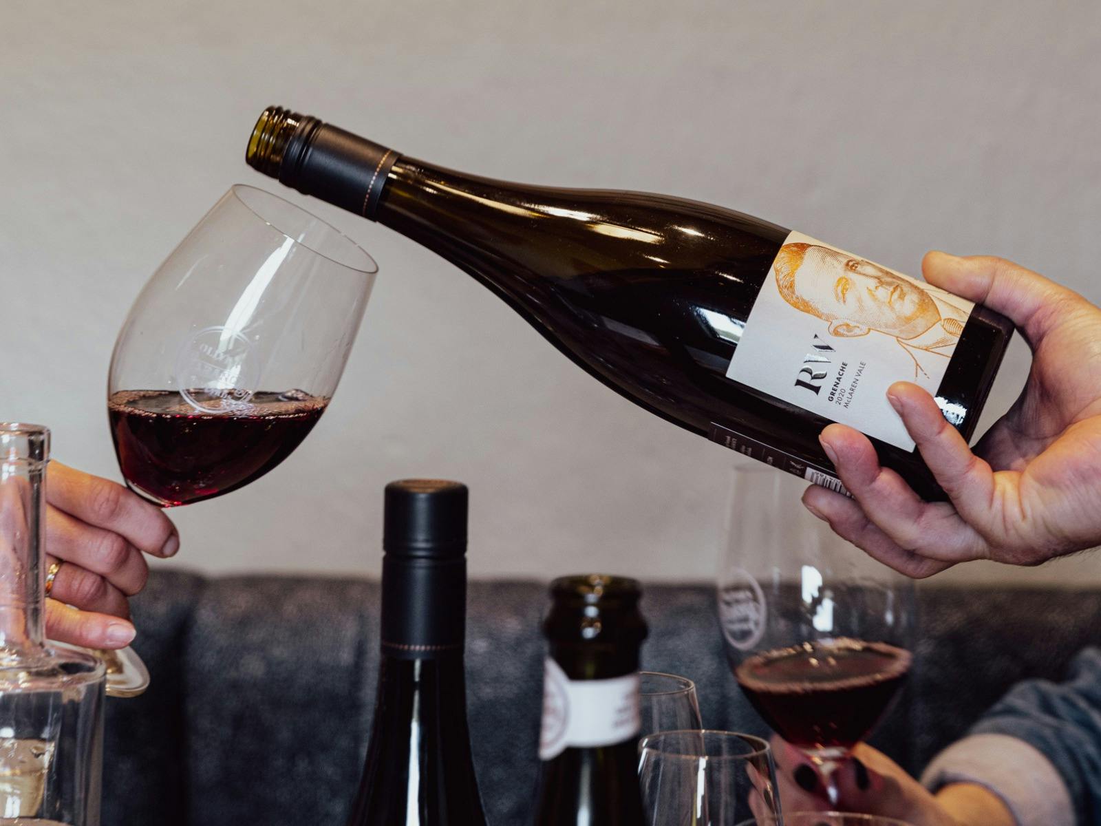 Bottle of wine being poured into glass