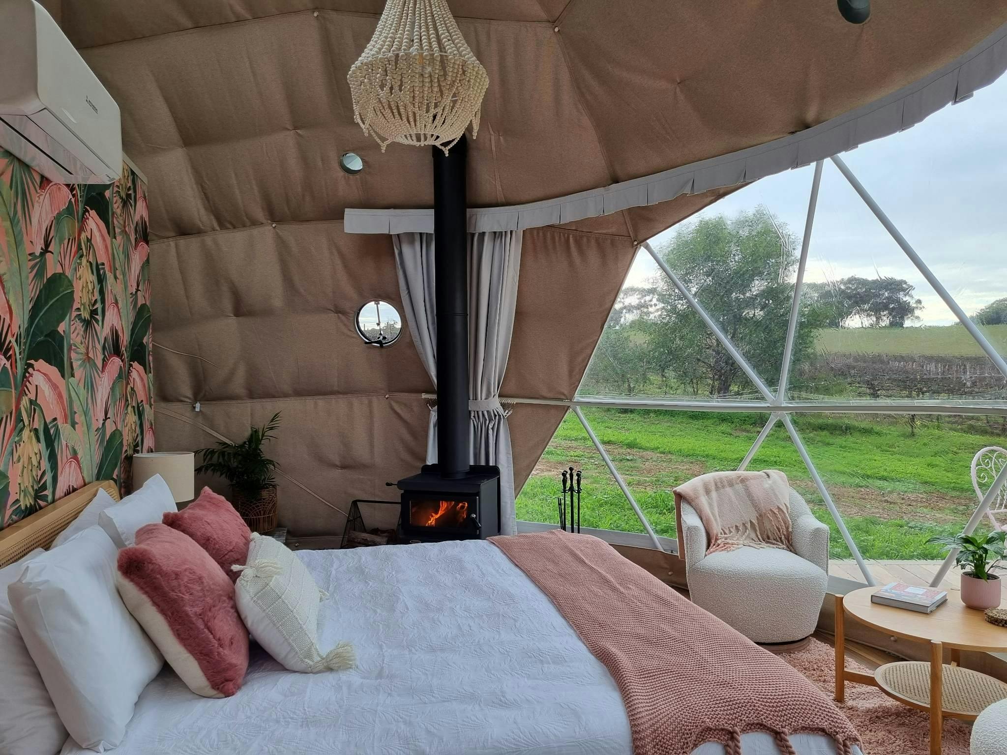 Wild Spirit Dome complete with fireplace, king bed, bathroom, claw foot bath and luxury furnishings