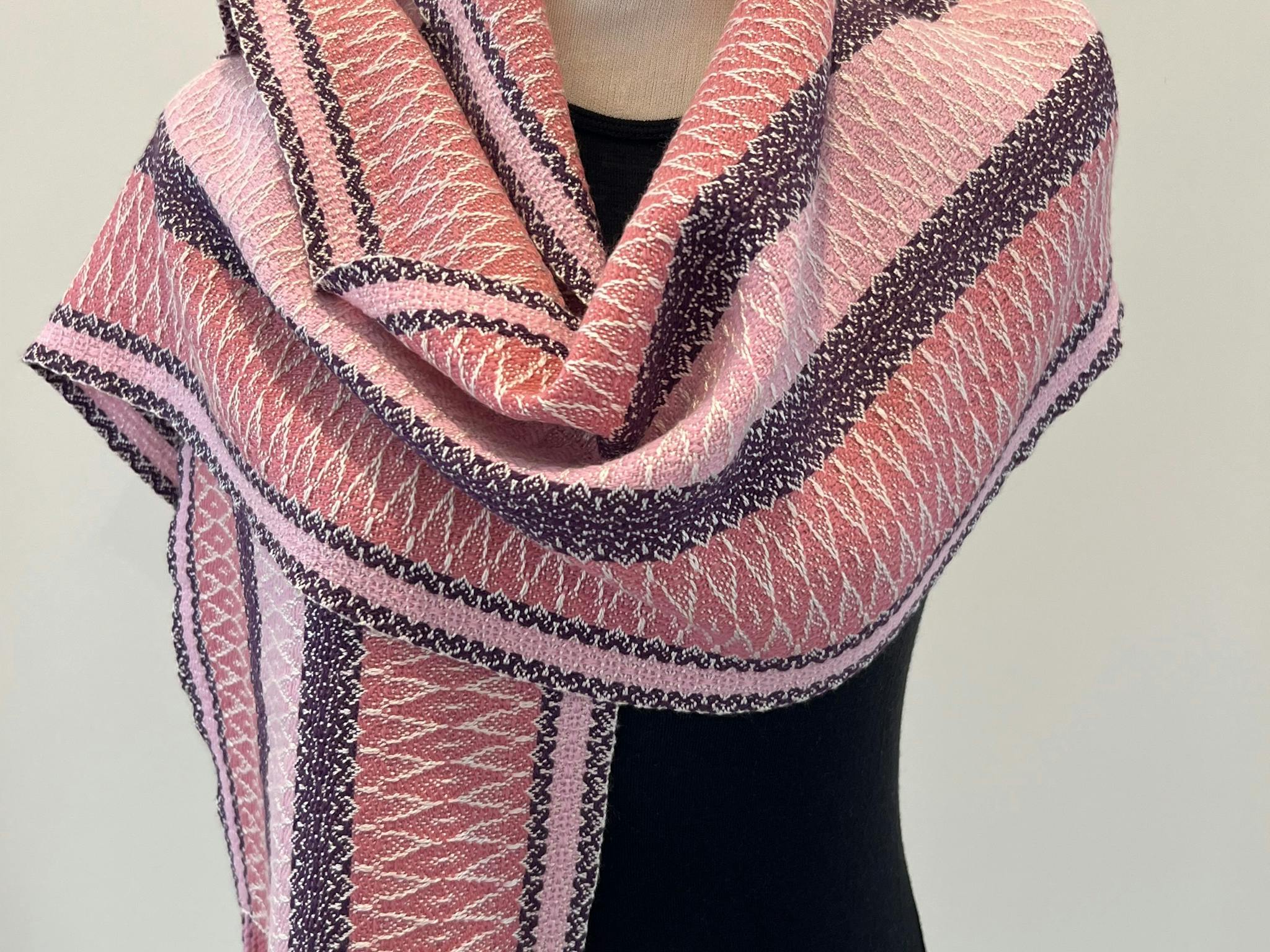 A stunning pink and shades of red shawl for colder evenings