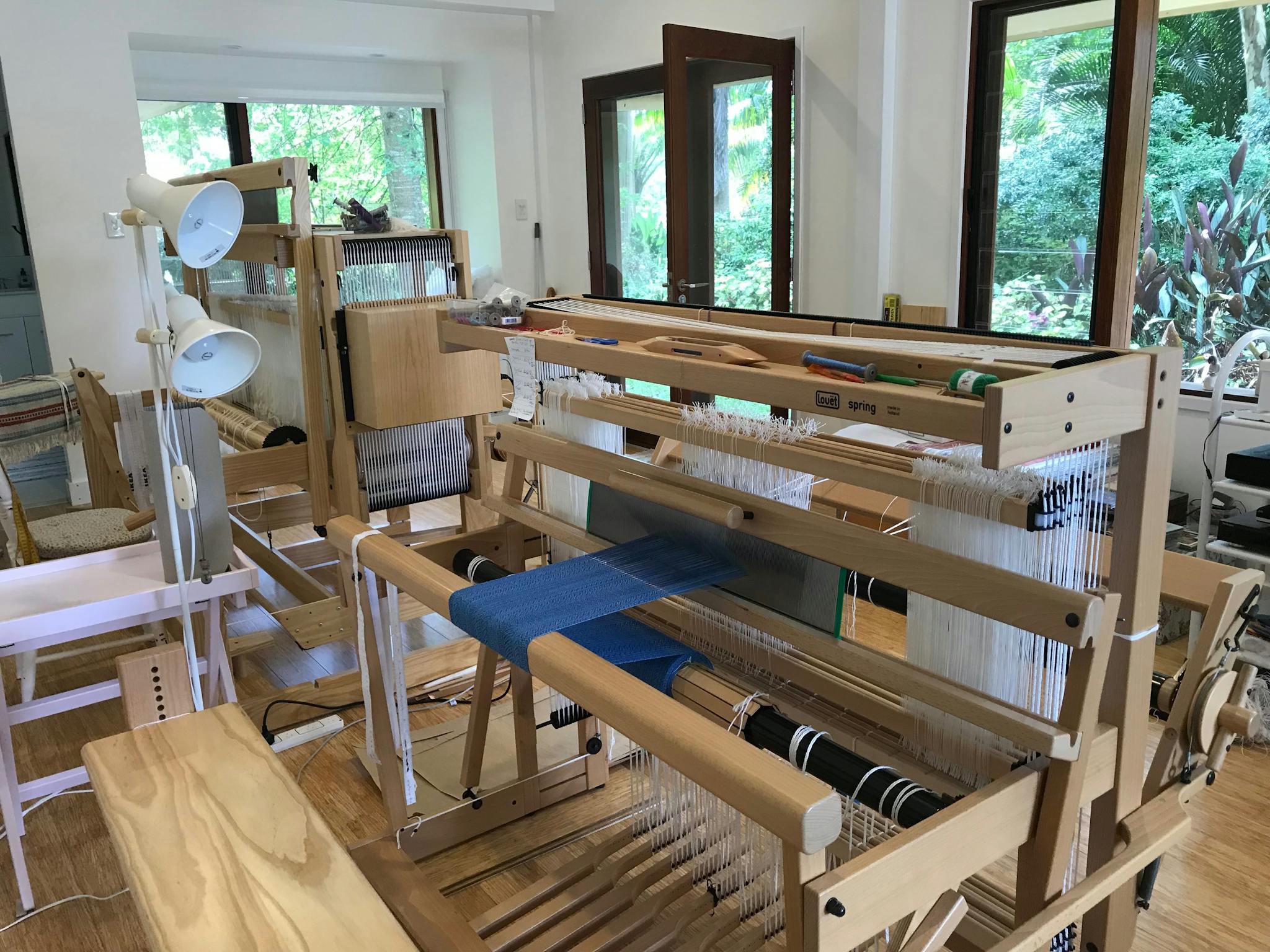 a large weaving loom which is operated by a hand-weaver using hands and feet